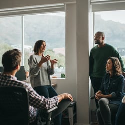 four people talking