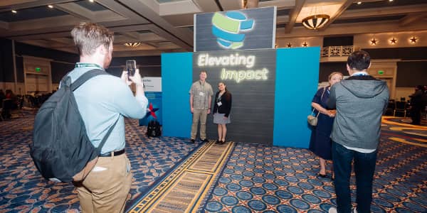 Participants posing with sign