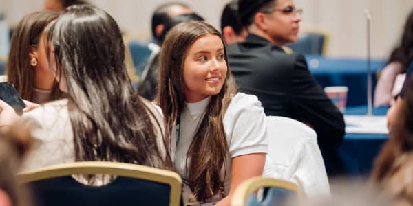Young woman watching presentation